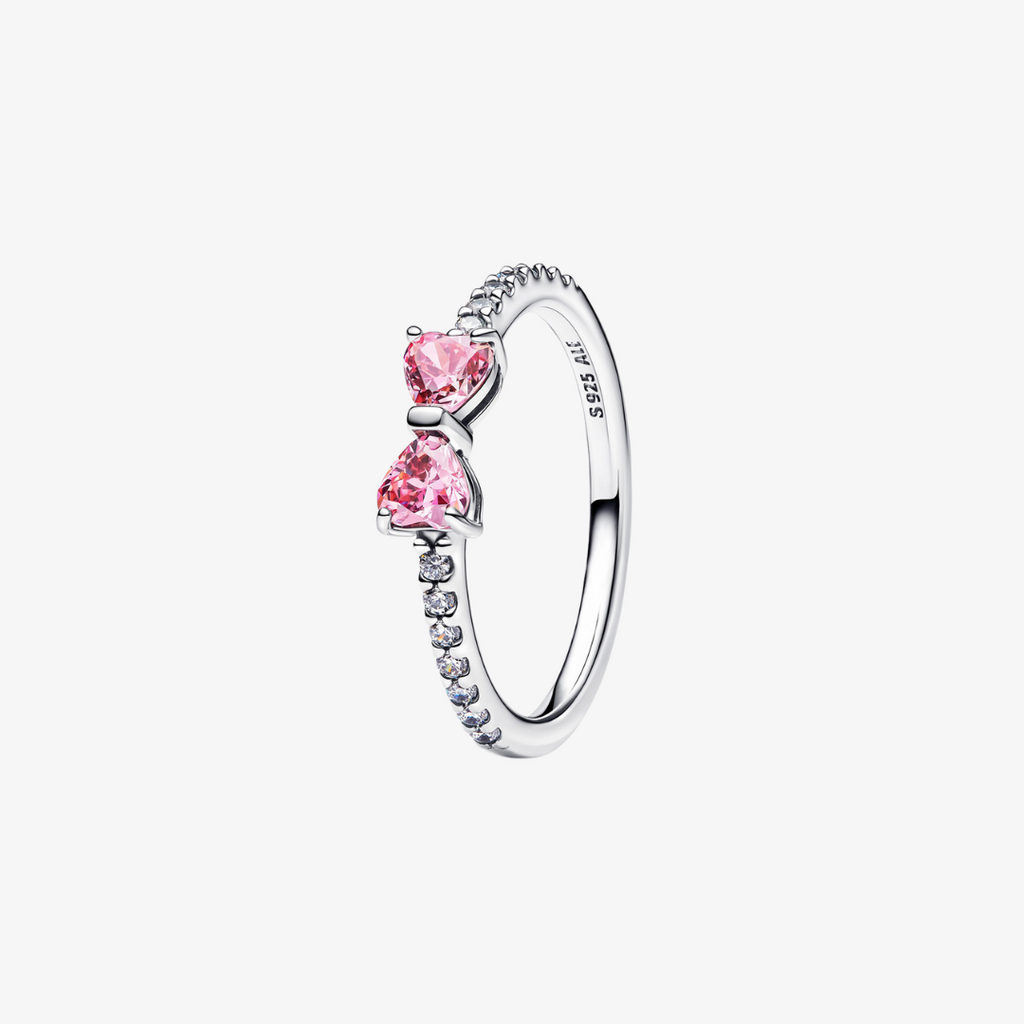 Delikat ring formet som en sløjfe med sølvbånd og pink eller hvide cubic zirconia-sten