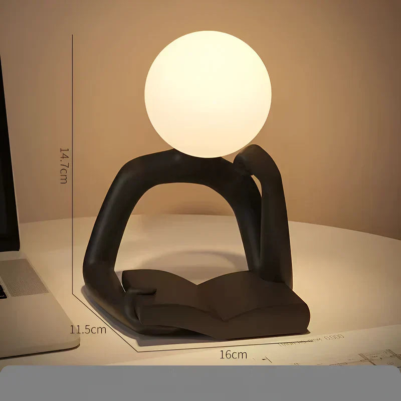 Lampada da Tavolo da Lettura Aura LumenFigure per Libri con Design Scultoreo