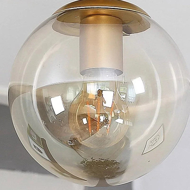 Aurelo Orb Deckenleuchte mit klarem Glaskugel und minimalistischem Metallhalter
