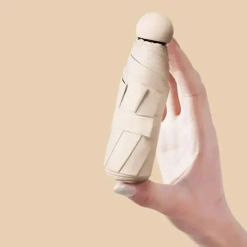 Paraguas compacto Nexa Capsule para viaje y uso diario