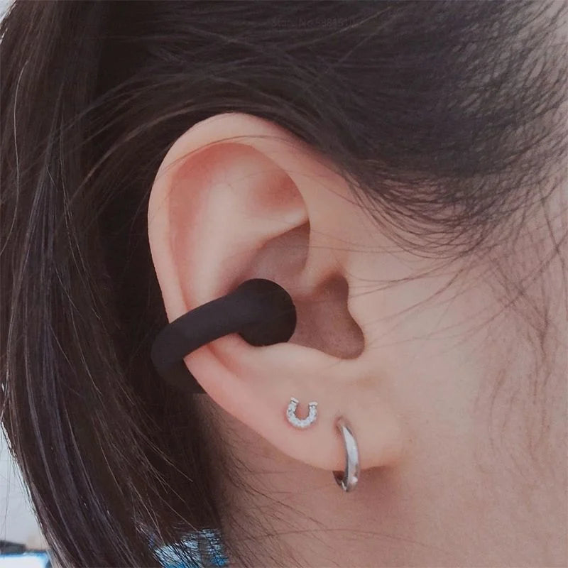 Draadloze open-ear oordopjes met botgeleidingstechnologie
